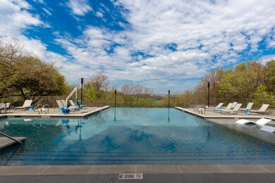 Community pool featuring a patio