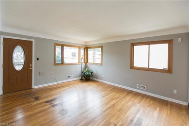 Living room with exposed hardwood floors