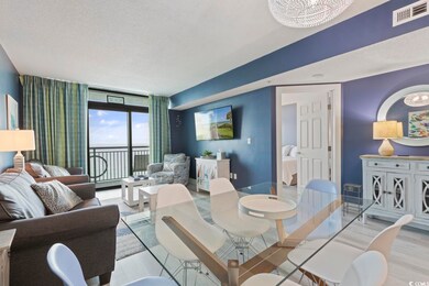 Living room featuring a wall of windows, a notable