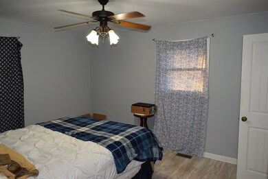 Master bedroom with an attached Master bath with shower only. 
