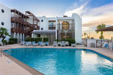 Pool at dusk with a patio area