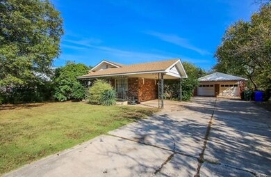 Single story home with an outbuilding, a garage ap