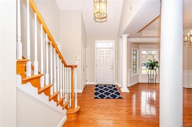 Foyer open to dining room and 2 story foyer