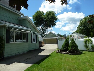 The cement driveway has a large 2 car pad behind the house, without losing green space.