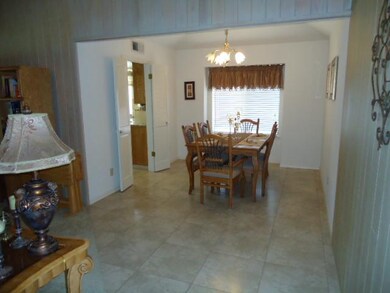 Formal dining area includes updated tile floor.