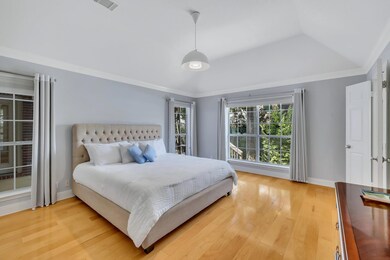 Bedroom with light wood-type flooring, vaulted ce