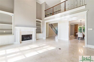 Formal great room with fire place and custom built