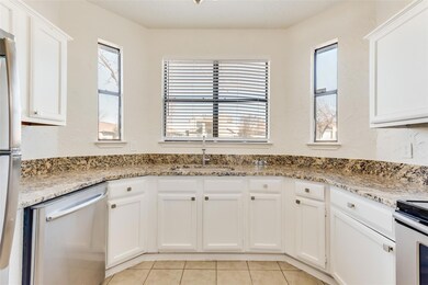 Kitchen featuring stainless steel appliances, ligh
