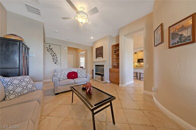 Entry flows into large living room with fireplace