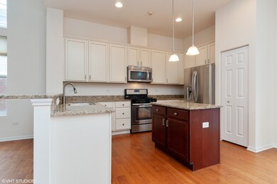 Kitchen with Stainless Steel Appliances and Granit