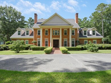 This one-of-a-kind residence is located on 5.7 +/- acres.