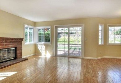 Family room. It has gas fireplace. All windows and