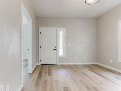 Foyer with light hardwood / wood-style floors