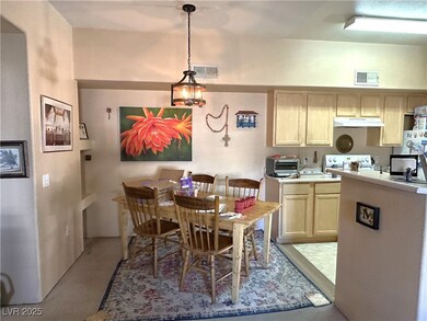 Kitchen with under cabinet range hood, visible ven