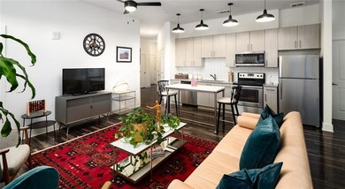 Living room with sink, dark hardwood / wood-style 