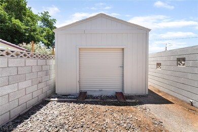 Garage featuring a storage shed