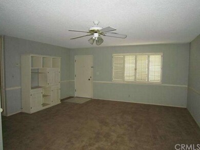 Living Room with Ceiling Fan & Plantation Shutters