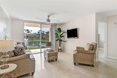 Living area featuring baseboards, ceiling fan, and light tile patterned floors