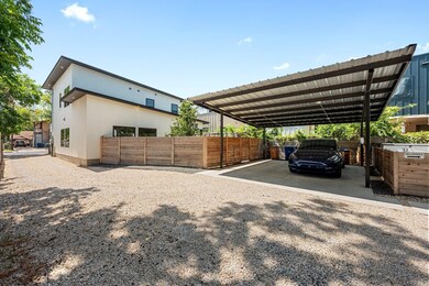 View of parking / parking lot featuring gravel dr