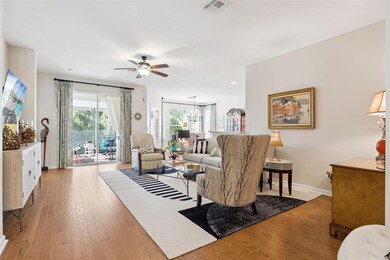 View of the 15' x 22' Great Room w/ engineered wood floor & a ceiling fan
