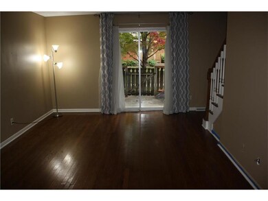 Living room with hardwood floors and access to the