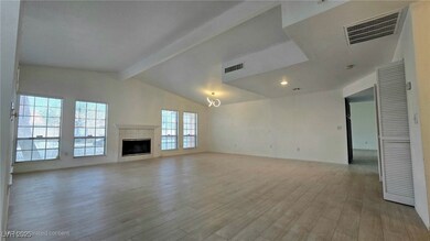 Unfurnished living room with light wood-style floo