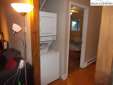 Stack washer/dryer off hallway