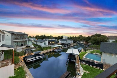 View of dock featuring a water view, fence, a res