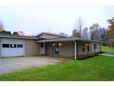ONE CAR GARAGE WITH EXTRA ROOM FOR A WORK BENCH AN
