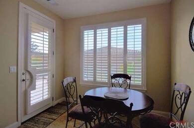 Light and bright breakfast nook located off of bac