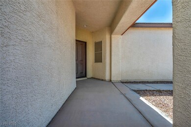 View of exterior entry with stucco siding
