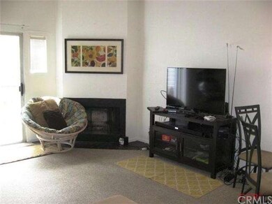 Livingroom has slider to deck/balcony and a firepl