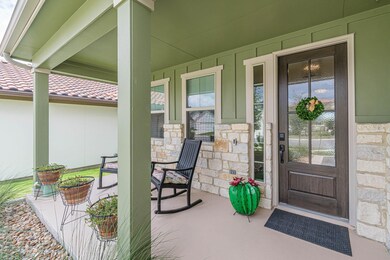 View of exterior entry featuring stone siding and