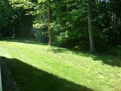 Exterior Side View. Side lawn off deck.