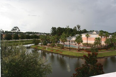 view of Pool and Clubhouse from entry