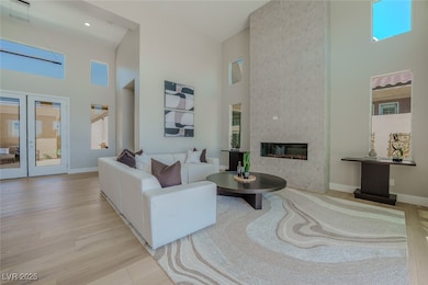 Living area with a towering ceiling, wood finished