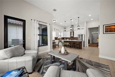 Living room with baseboards, light tile patterned