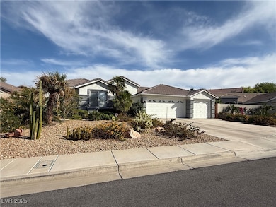 Ranch-style home with a garage, concrete driveway,