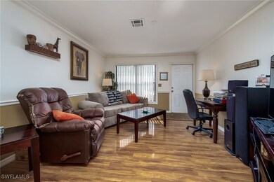 Office featuring ornamental molding and wood finis