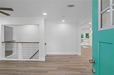 Empty room with crown molding, wood finished floors, ceiling fan, and recessed lighting