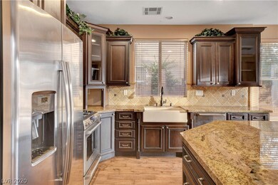 The kitchen includes stainless steel appliances.