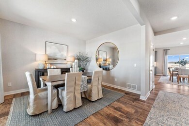 Open and inviting, you'll find space for all your family's needs. Photo of model home, colors and finishes are similar.