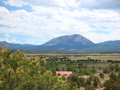 driveway view of home and mountains