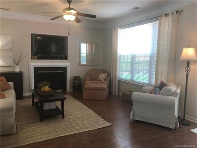 Adjacent to dining area is the living room with up
