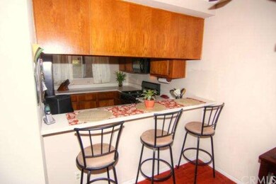 Breakfast bar opens to living & dining area