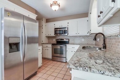 Kitchen with appliances with stainless steel finis