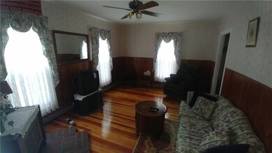 Family room with refinished hardwood floors