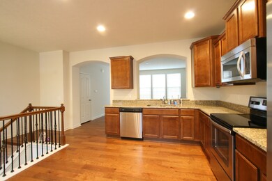 Custom Kitchen with Hardwoods, stainless appliances and granite tops.