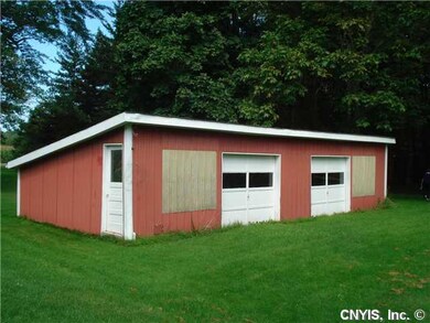 Shed. Large shed with 2 overhead doors.