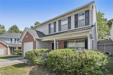 Traditional-style home with concrete driveway, an 